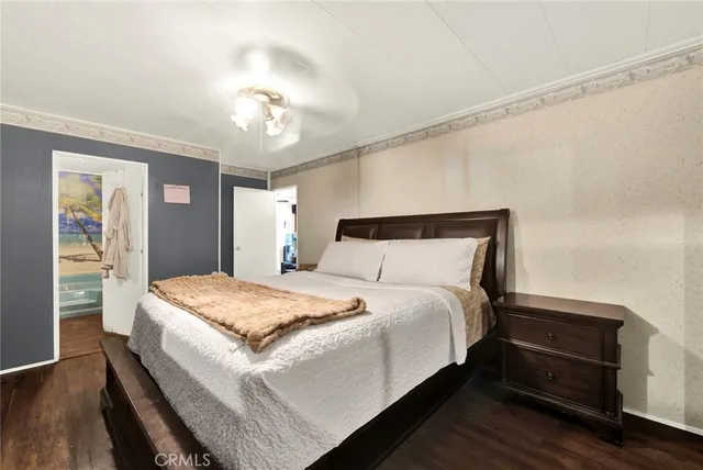 a bedroom with bed and window