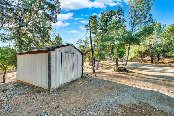a view of a backyard of the house