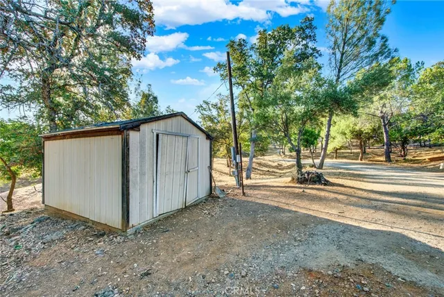 a view of a backyard of the house