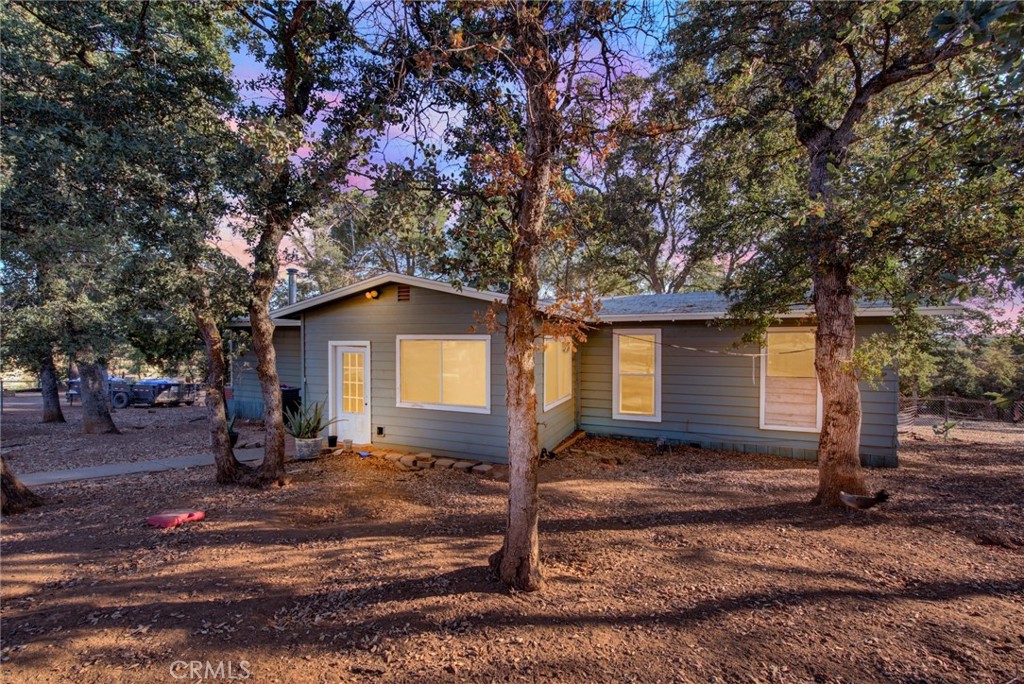 14721 Nevis Road Red Bluff, CA 96080 - Photo 49 of 50 a front view of a house with a yard