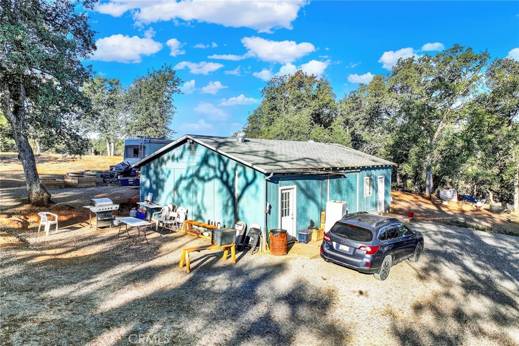 14721 Nevis Road Red Bluff, CA 96080 - Photo 5 of 50 a view of a house with backyard and sitting area