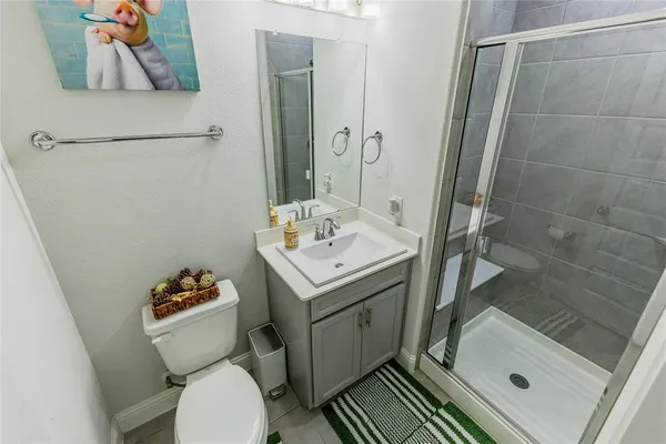 a view of a bathroom with a shower and a tub