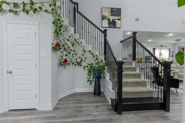a view of entryway with wooden floor