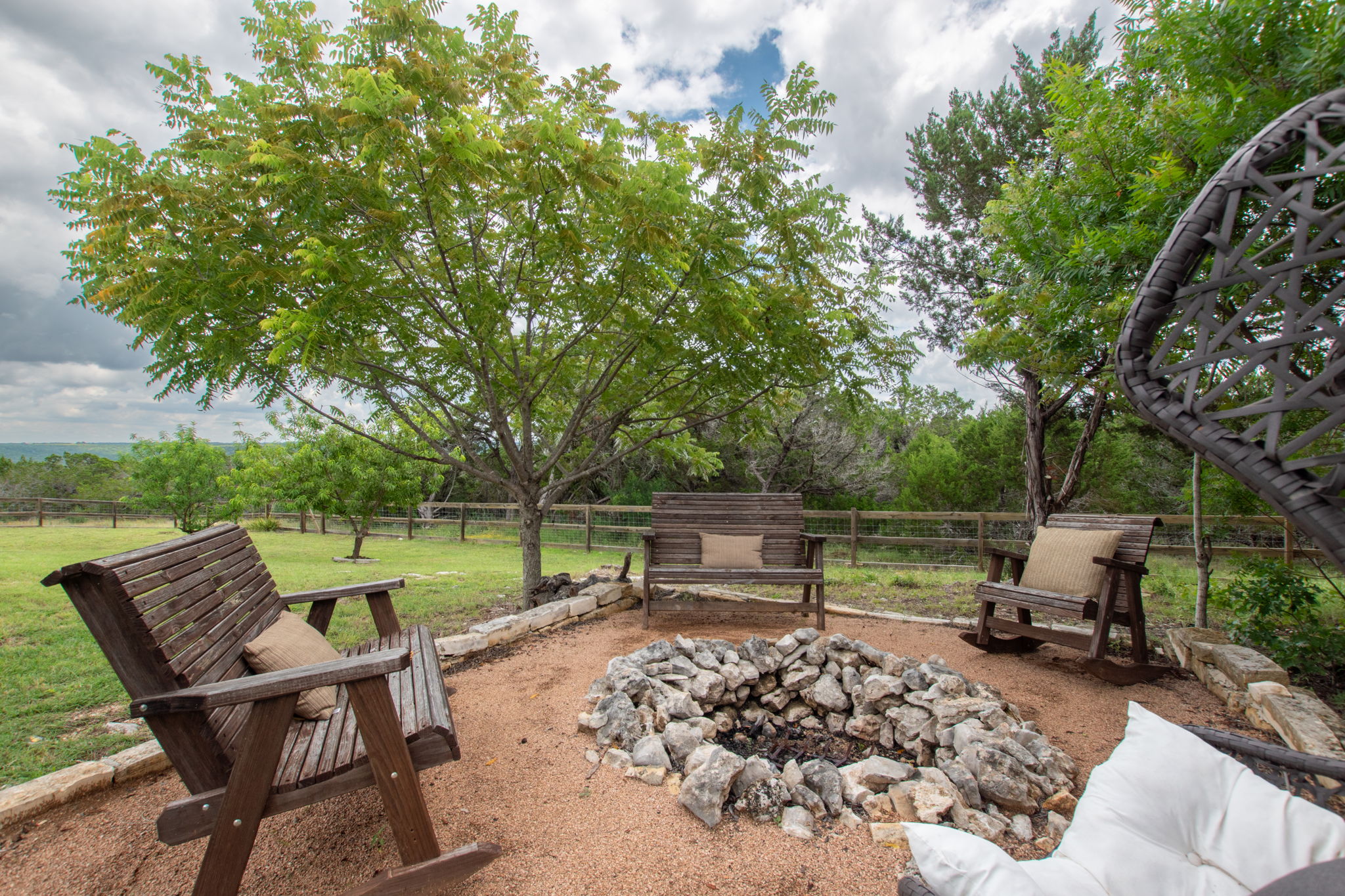 155 Balcones Ridge Way Bertram, TX 78605 - Photo 8 of 37 Gather around the fire pit for tranquil evenings under the open sky.