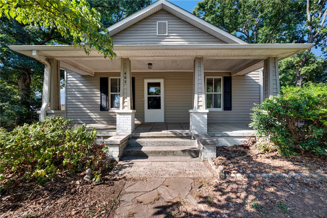 403 Lewis Street Anderson, SC 29624 - Photo 2 of 35 An inviting covered front porch with classic columns welcome visitors to this charming cottage.