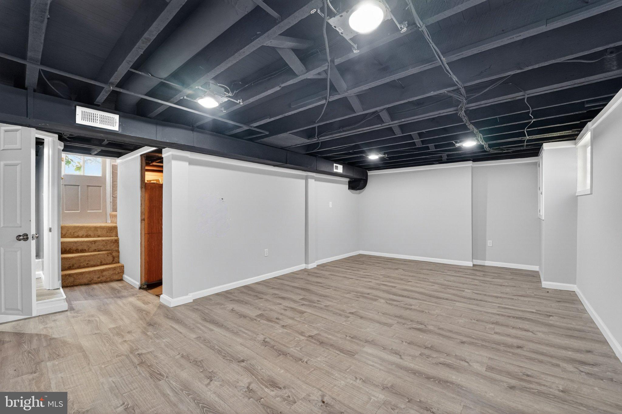 5312 Catalpha Road Baltimore, MD 21214 - Photo 41 of 59 a view of empty room with wooden floor