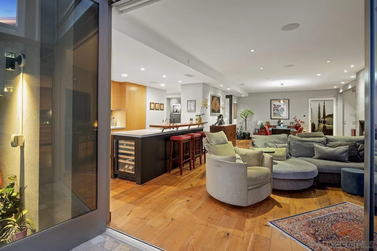 645 Front Street, Unit 2101 San Diego, CA 92101 - Photo 15 of 32 a living room with furniture and a kitchen view