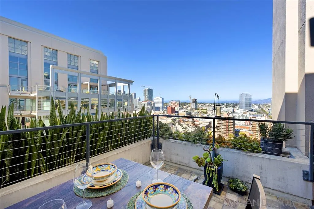 645 Front Street, Unit 2101 San Diego, CA 92101 - Photo 19 of 32 a view of a balcony with food and a potted plant