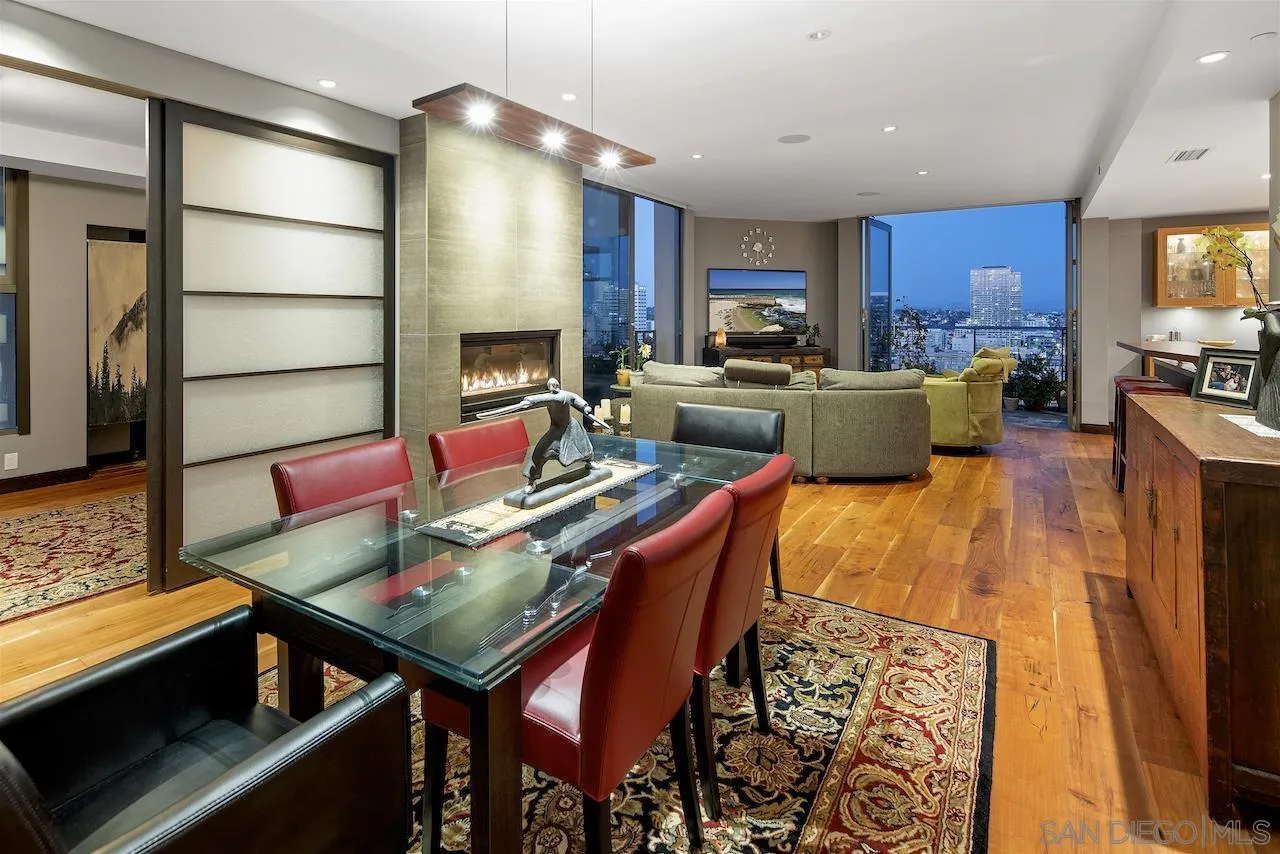 645 Front Street, Unit 2101 San Diego, CA 92101 - Photo 2 of 32 a living room with stainless steel appliances kitchen island granite countertop a stove a sink a refrigerator and a microwave