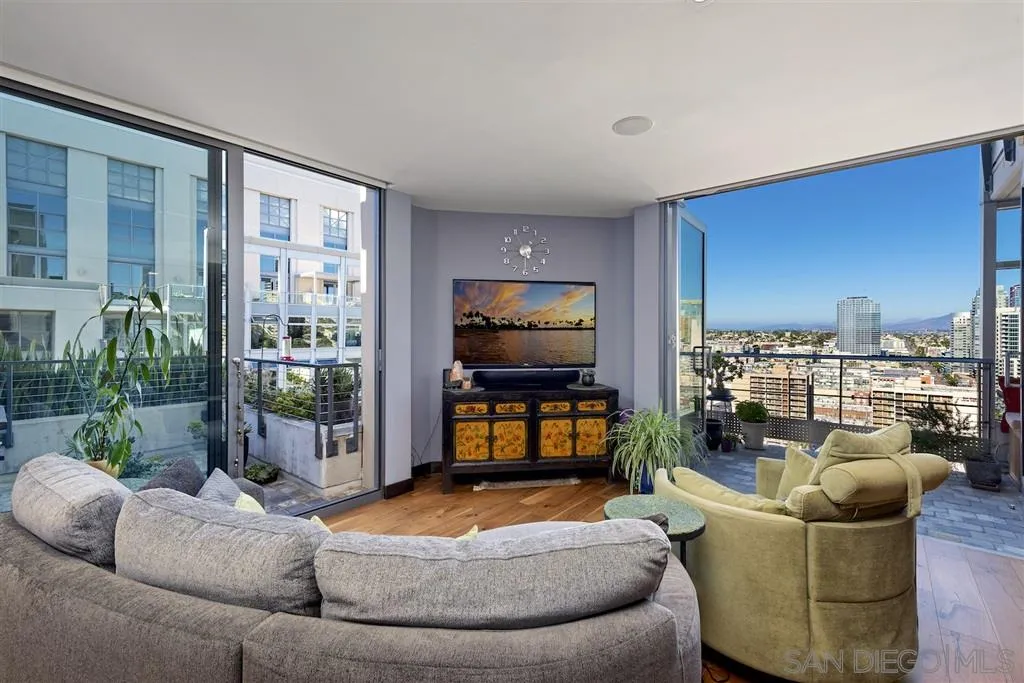 645 Front Street, Unit 2101 San Diego, CA 92101 - Photo 22 of 32 a living room with furniture and a flat screen tv