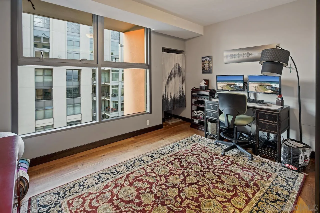 645 Front Street, Unit 2101 San Diego, CA 92101 - Photo 23 of 32 a bed room with a bed and a chair