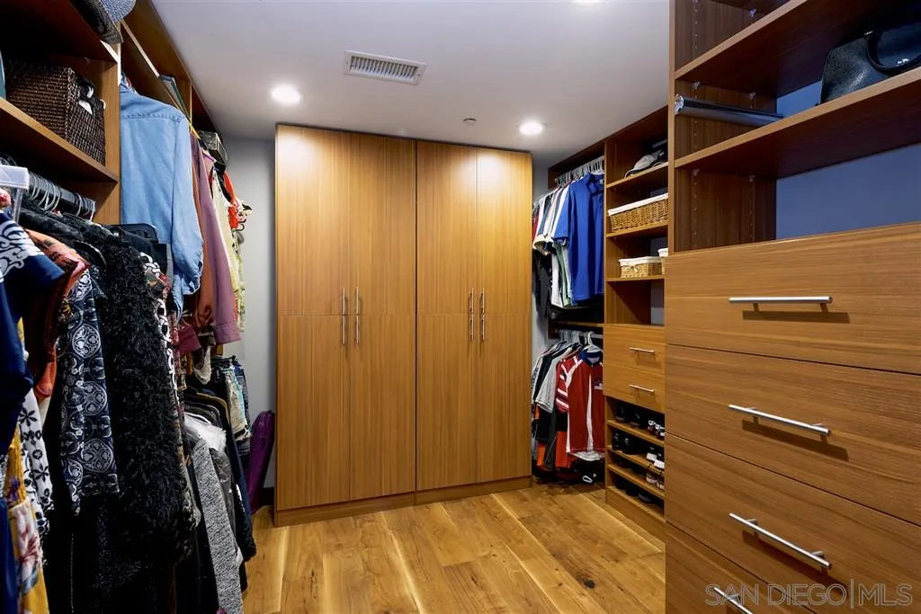 645 Front Street, Unit 2101 San Diego, CA 92101 - Photo 27 of 32 a view of walk in closet with clothes