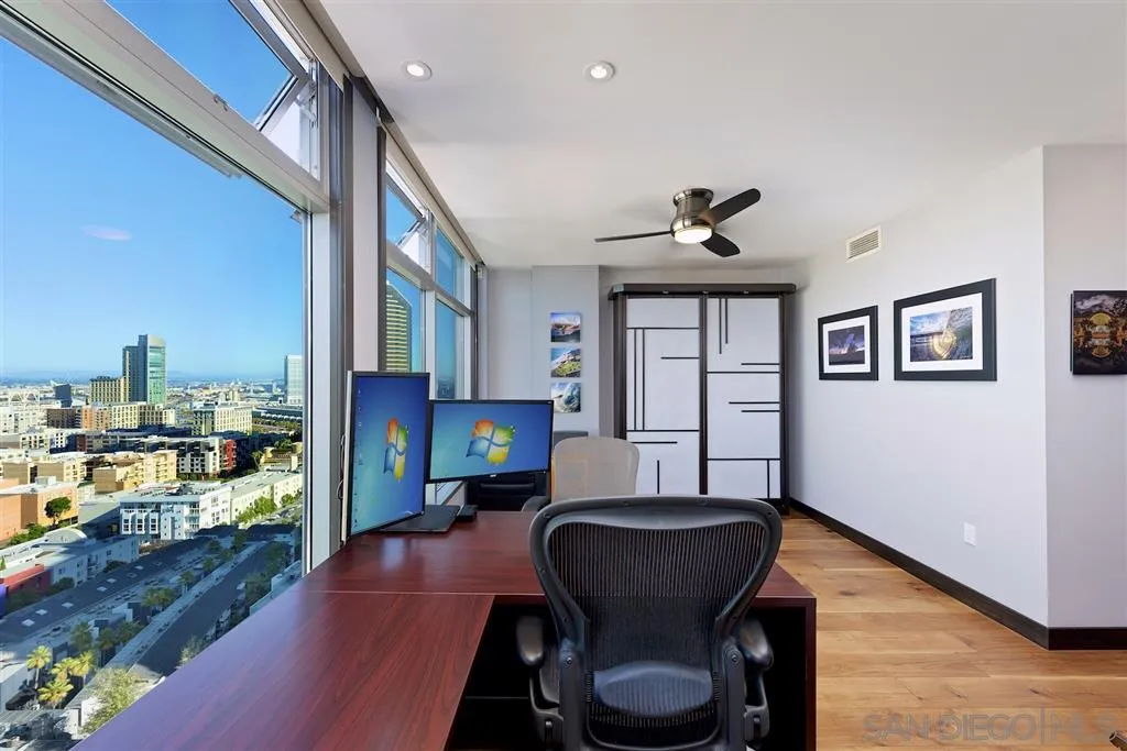 645 Front Street, Unit 2101 San Diego, CA 92101 - Photo 29 of 32 a living room with furniture and a fireplace