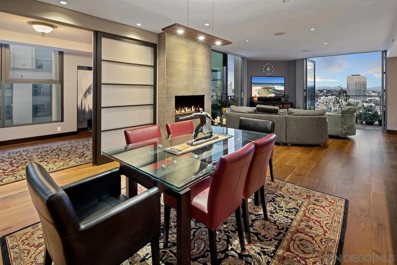 645 Front Street, Unit 2101 San Diego, CA 92101 - Photo 3 of 32 a dining room with furniture and wooden floor