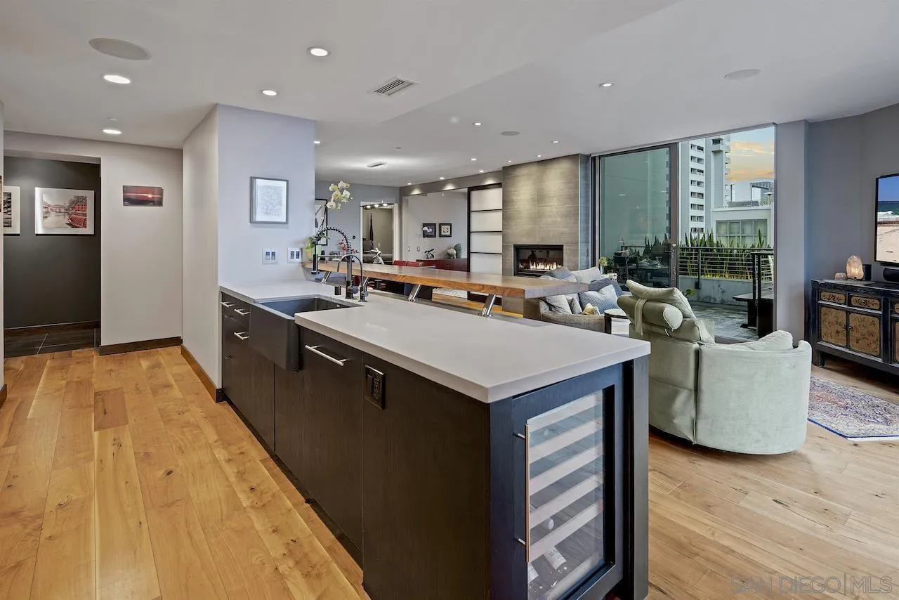 645 Front Street, Unit 2101 San Diego, CA 92101 - Photo 9 of 32 a kitchen with stainless steel appliances a sink a counter top space and living room view
