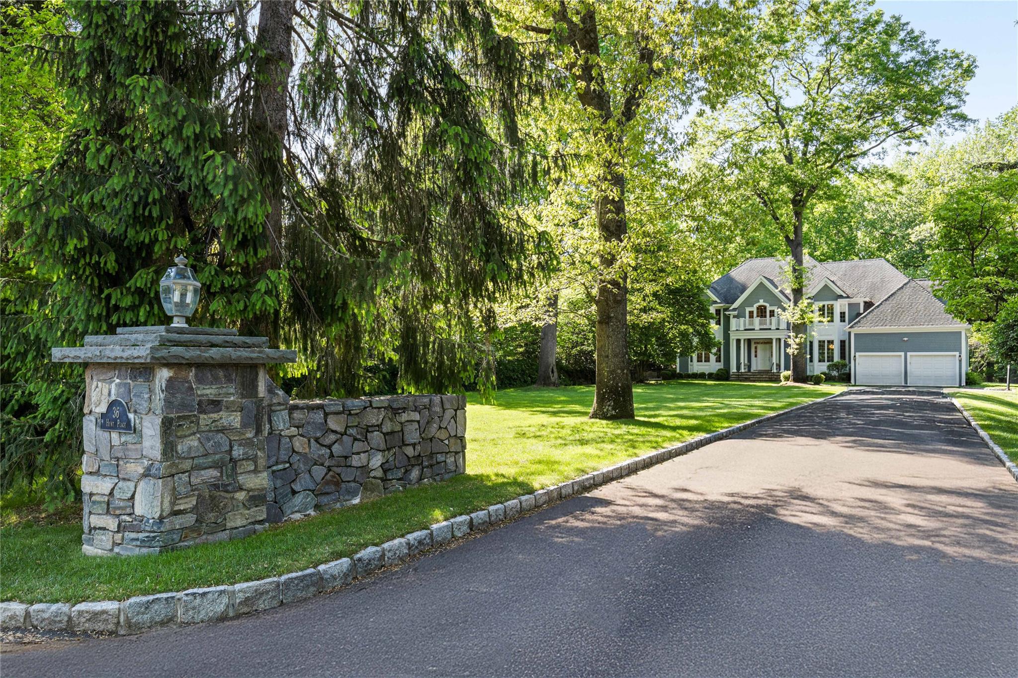 36 Hunt Place Rye, NY 10580 - Photo 1 of 1 a view of a house with a yard and large tree