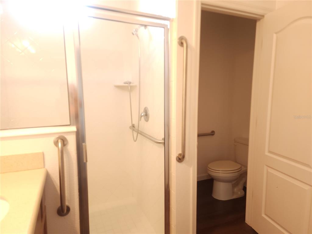 3230 Stratton Circle Kissimmee, FL 34744 - Photo 17 of 28 a bathroom with a shower and a toilet
