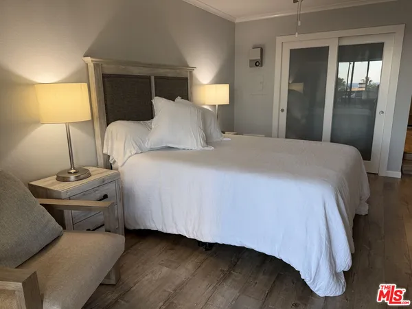 a bedroom with a bed and lamp