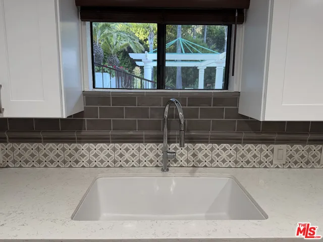 a view of a sink and a window