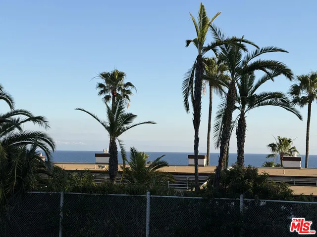 a kitchen with a granite countertop sink and a dishwasher