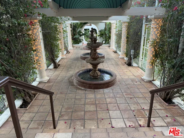 a view of a beach with a palm tree