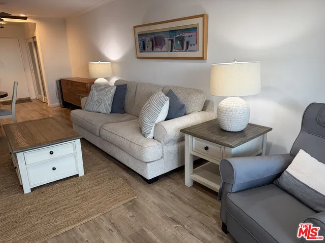 a living room with furniture and a lamp