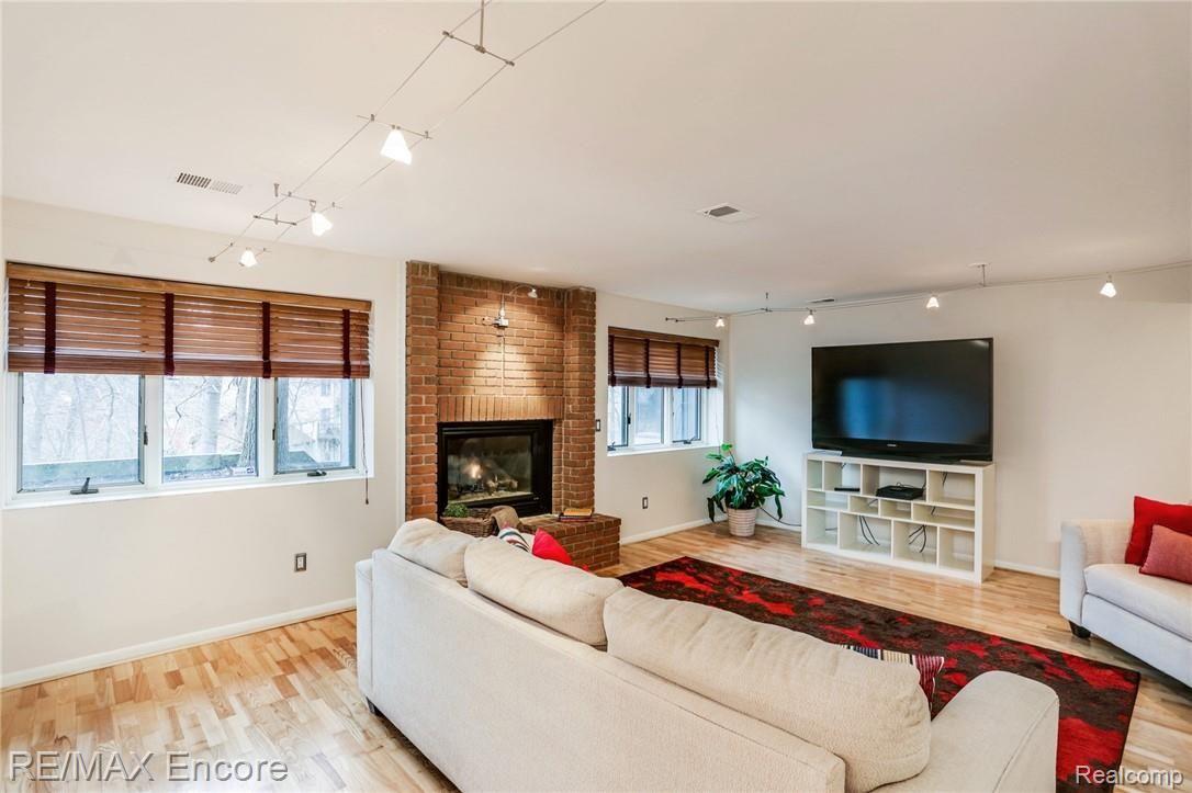 8880 Michigamme Road Clarkston, MI 48348 - Photo 22 of 31 Lower Level Recreation Room with Gas Fireplace