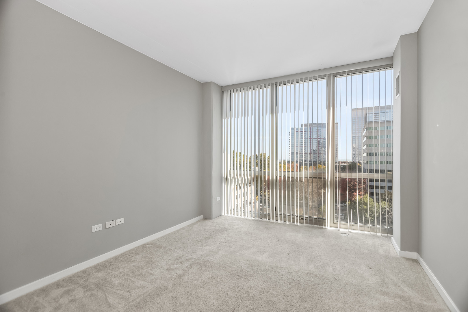 1845 South Michigan Avenue, Unit 808 Chicago, IL 60616 - Photo 9 of 14 a view of an empty room with glass door