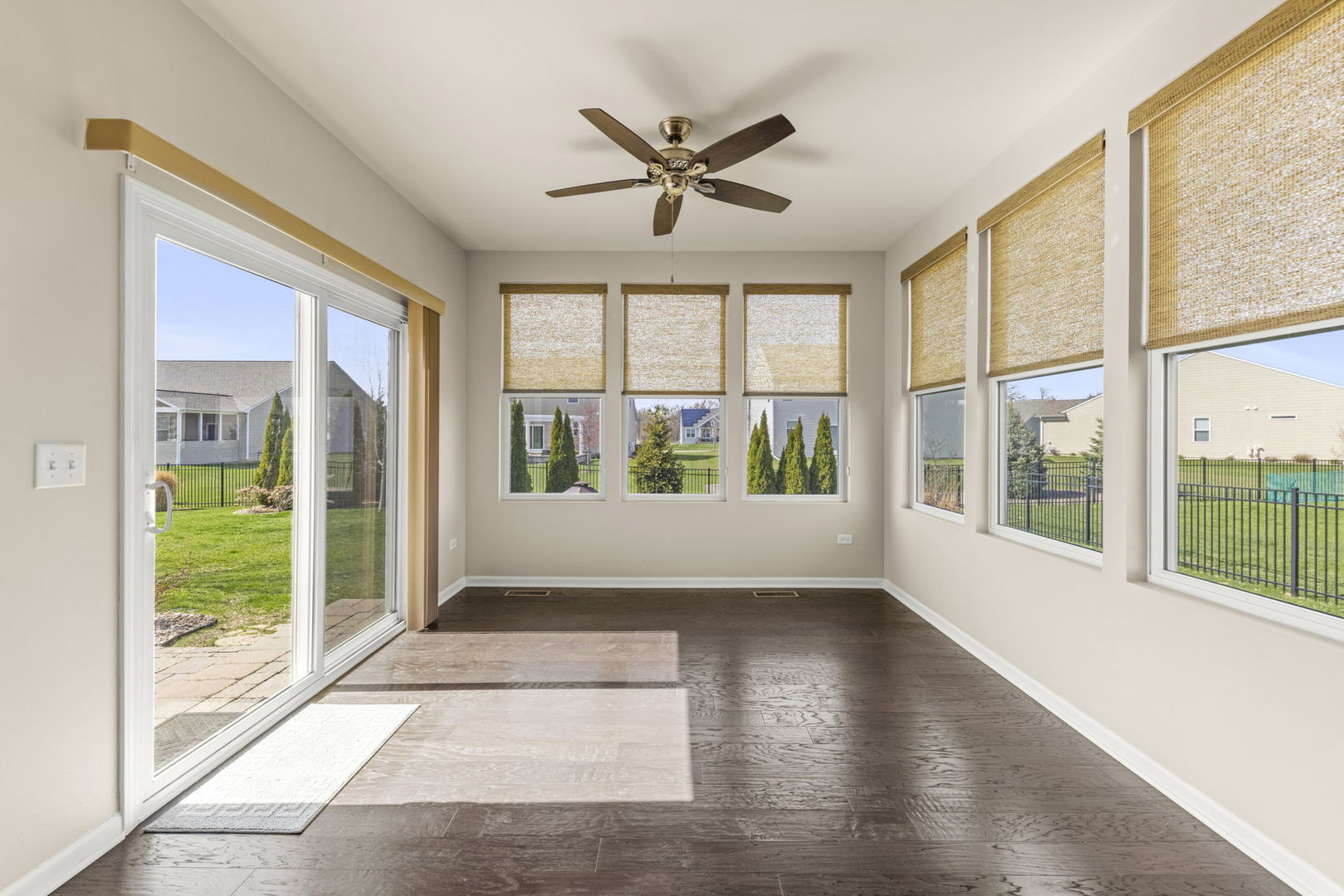 1433 Ruby Drive Yorkville, IL 60560 - Photo 12 of 25 a view of an empty room with wooden floor and a window