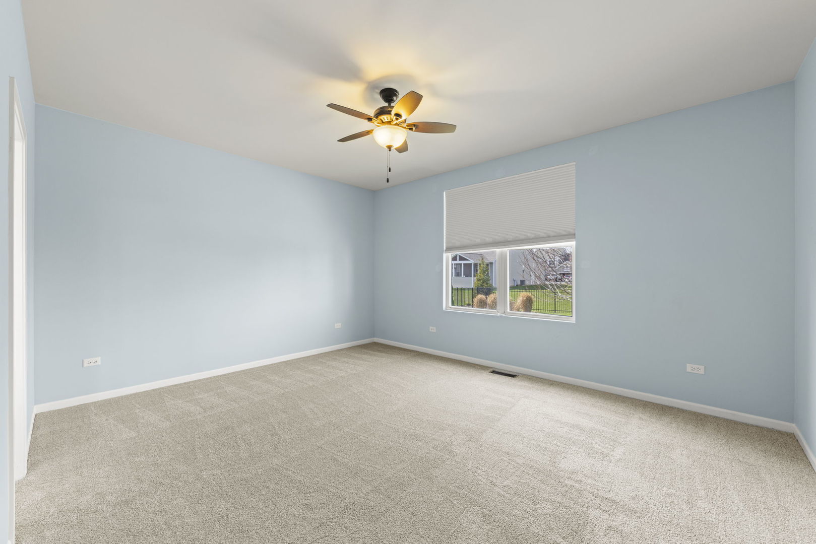 1433 Ruby Drive Yorkville, IL 60560 - Photo 15 of 25 an empty room with windows and fan