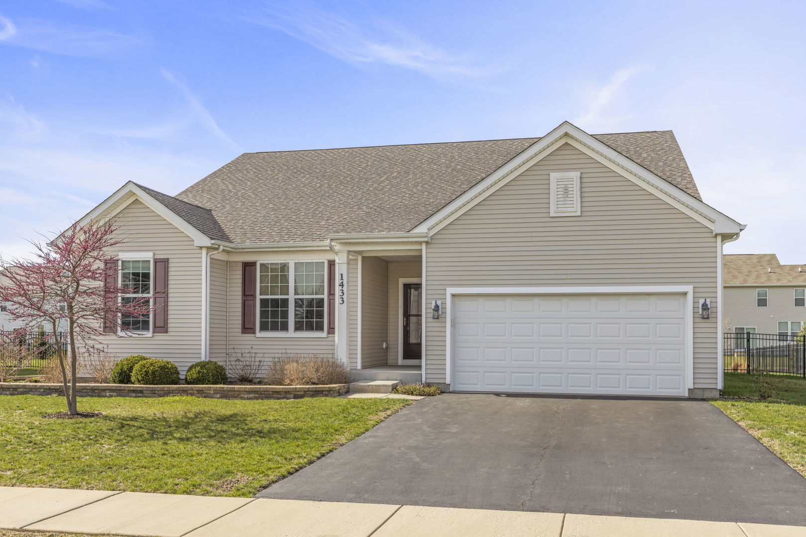 1433 Ruby Drive Yorkville, IL 60560 - Photo 2 of 25 a front view of a house with a yard and garage