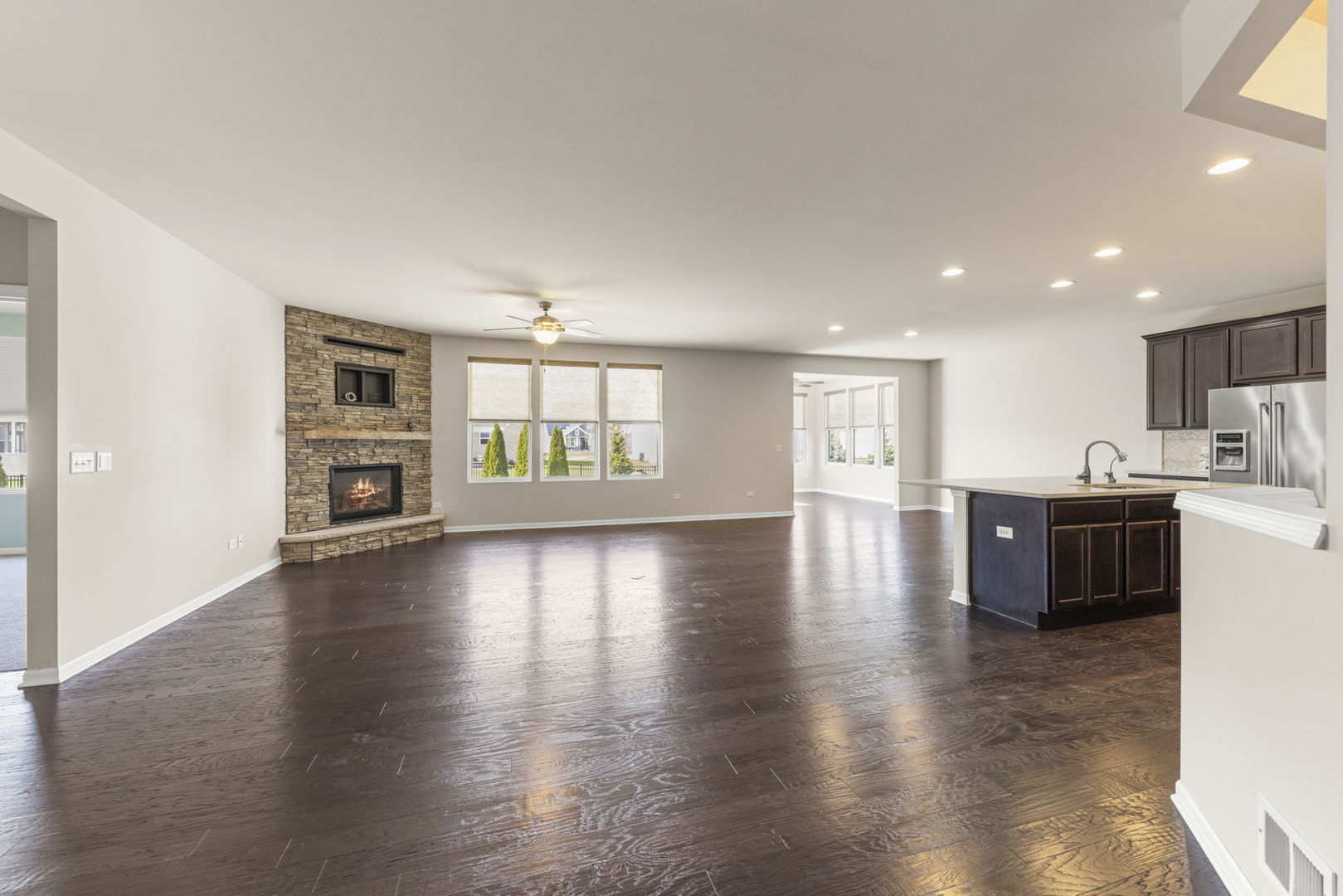 1433 Ruby Drive Yorkville, IL 60560 - Photo 5 of 25 a view of an empty room with window and wooden floor