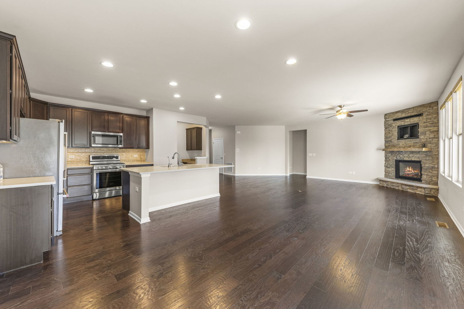 1433 Ruby Drive Yorkville, IL 60560 - Photo 7 of 25 a view of kitchen with wooden floor and windows