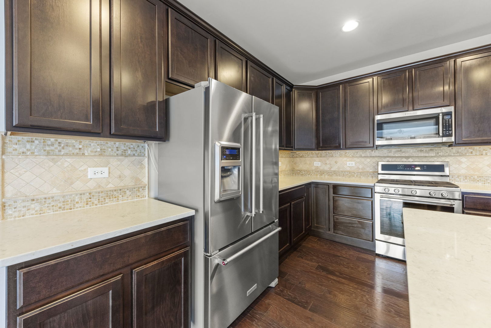 1433 Ruby Drive Yorkville, IL 60560 - Photo 9 of 25 a kitchen with granite countertop stainless steel appliances and wooden cabinets