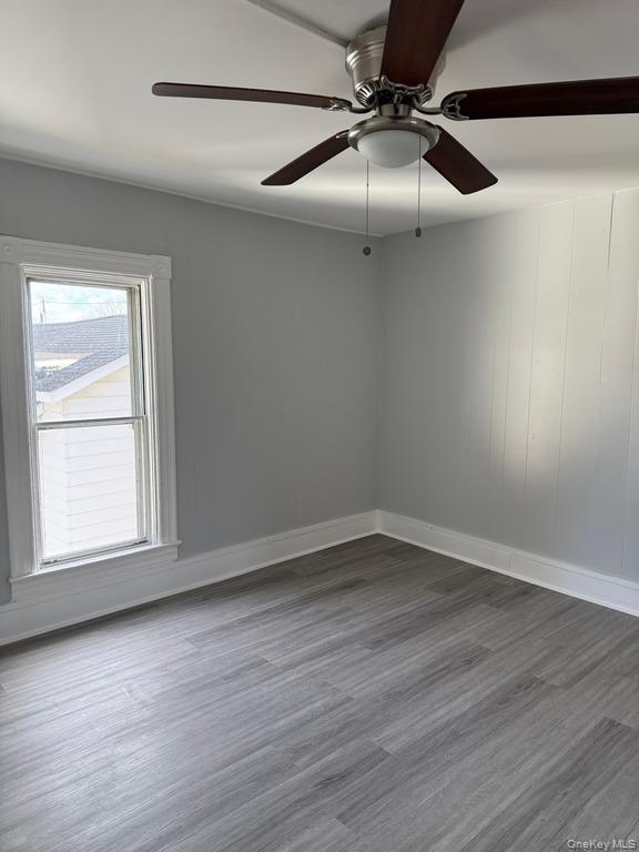 14 Glass Street Port Jervis, NY 12771 - Photo 7 of 11 an empty room with wooden floor closet and windows