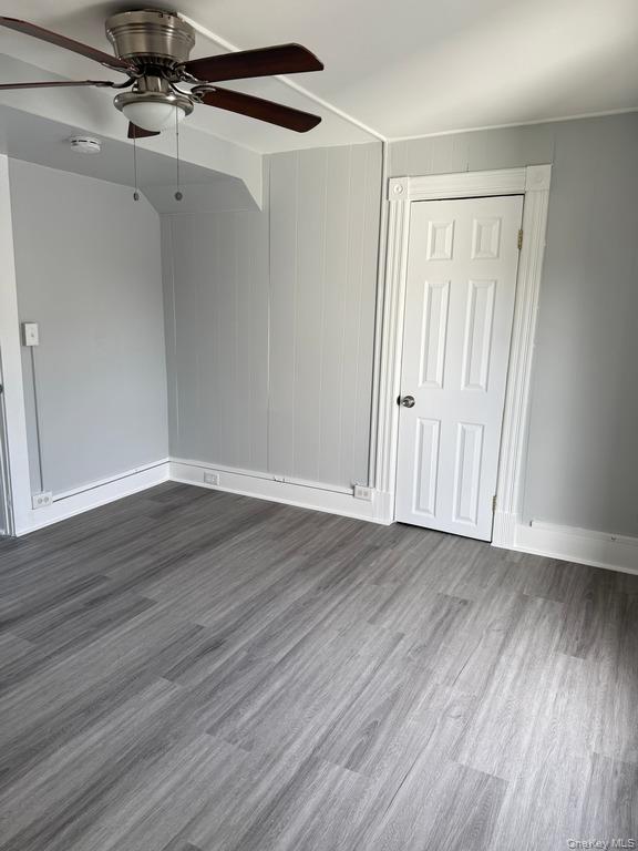 14 Glass Street Port Jervis, NY 12771 - Photo 8 of 11 a view of an empty room with wooden floor and a window