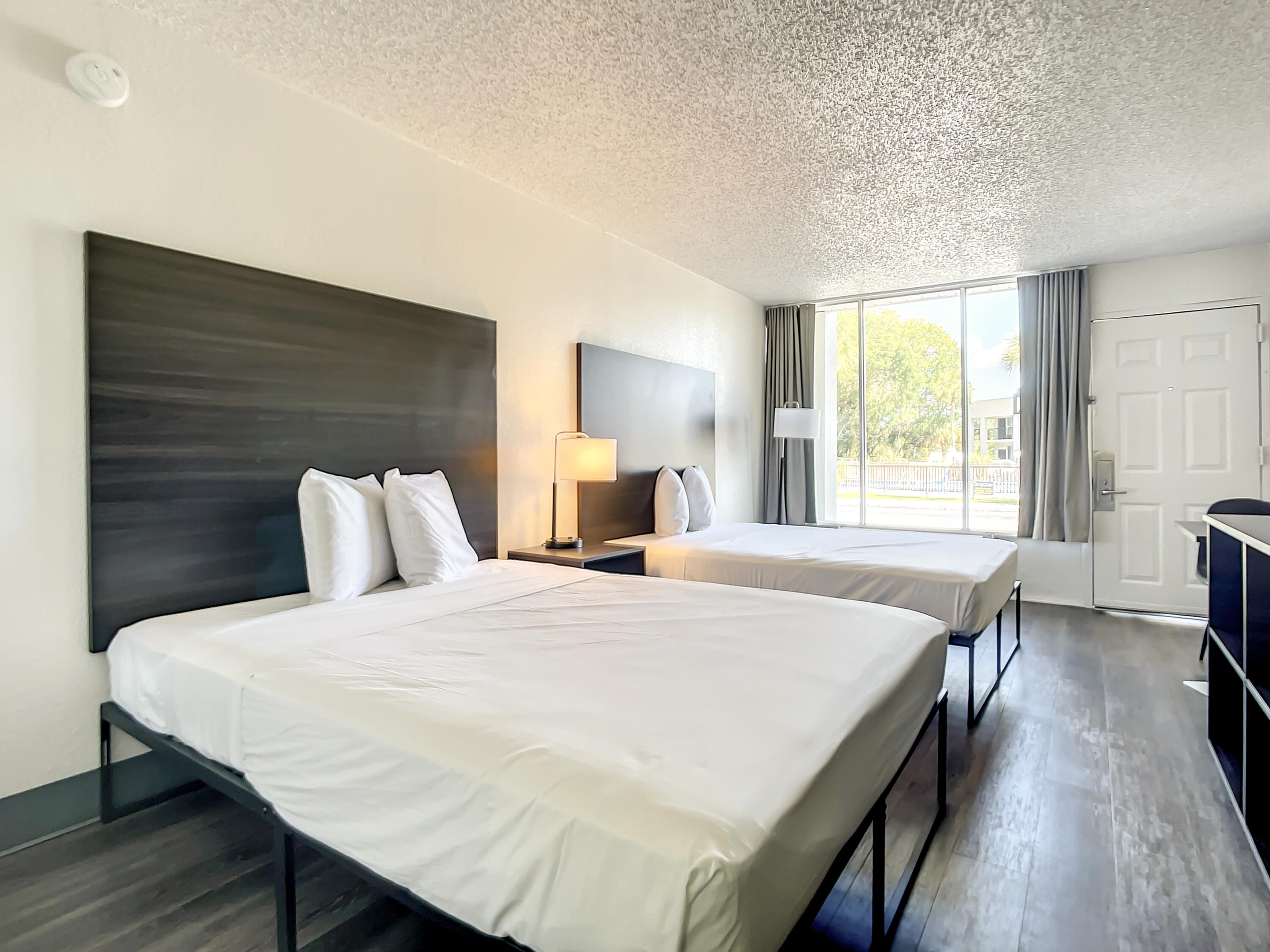 2535 State 16 Rd Street St. Augustine, FL 32092 - Photo 4 of 9 a bedroom with a bed and wooden floor