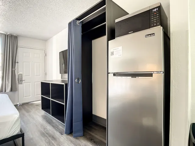 a refrigerator freezer sitting in a kitchen