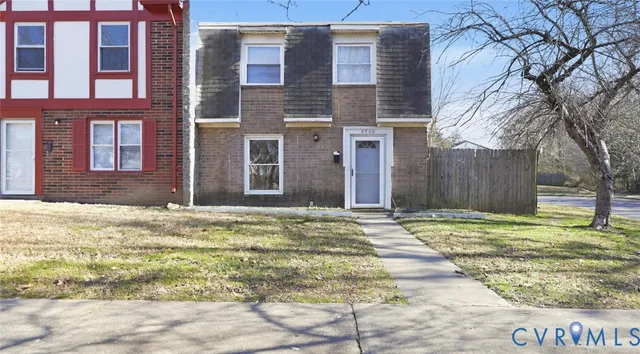 a kitchen with stainless steel appliances granite countertop a stove and a white cabinets