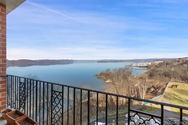 a view of a balcony with an outdoor seating
