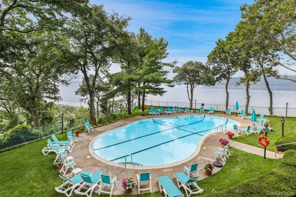 a view of a swimming pool with a patio