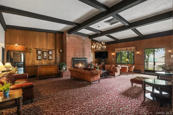 a spacious with pool table and chairs