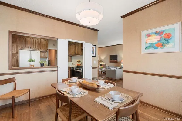 a kitchen with a table and chairs in it