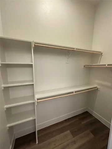 a view of an empty walk in closet