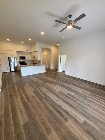 a view of a kitchen with a sink and a window