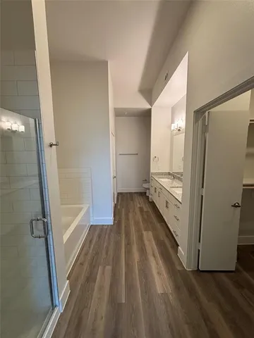 a view of a bathroom with a sink and a shower