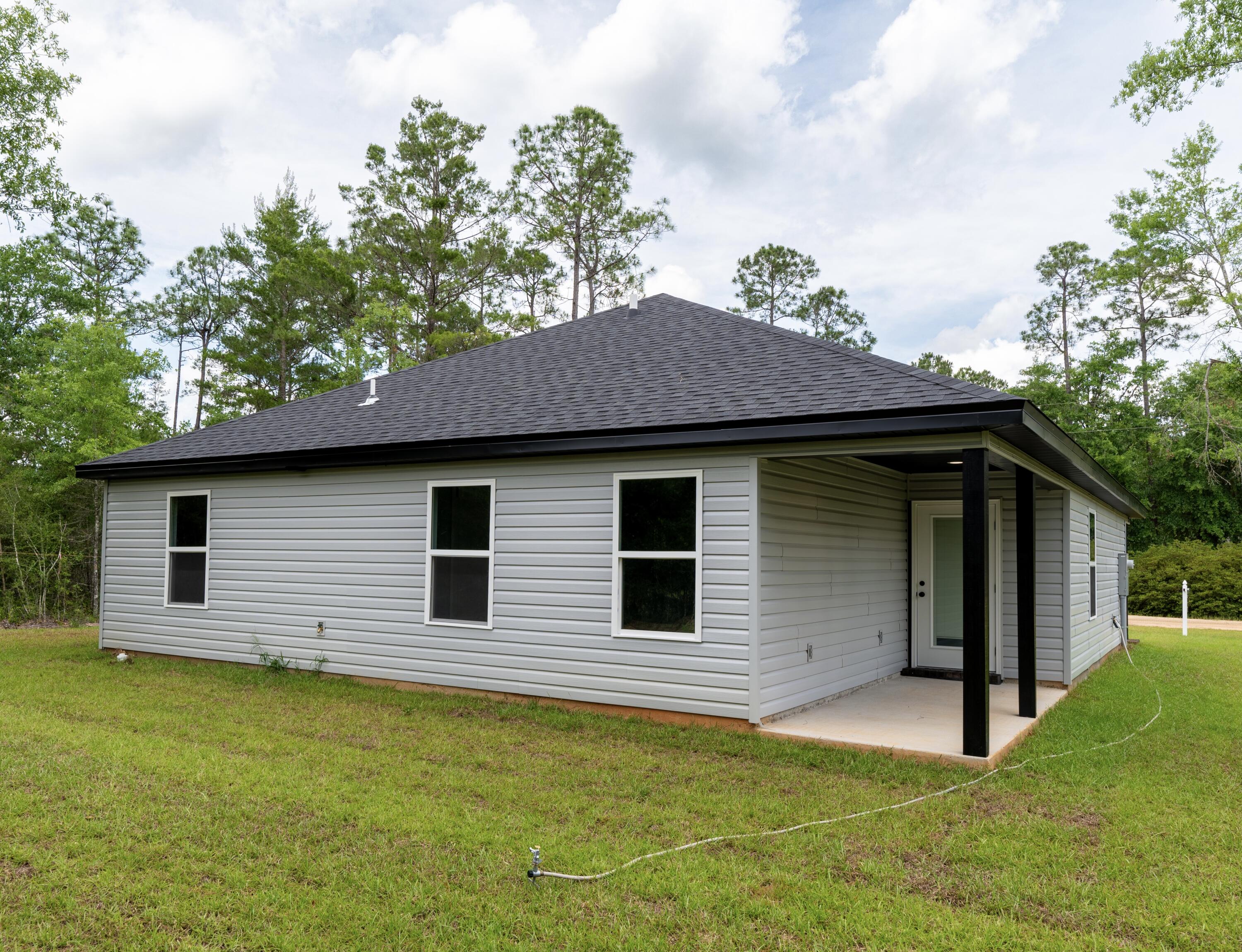 4618 Eagle Way Crestview, FL 32539 - Photo 12 of 12 a view of a house with a yard