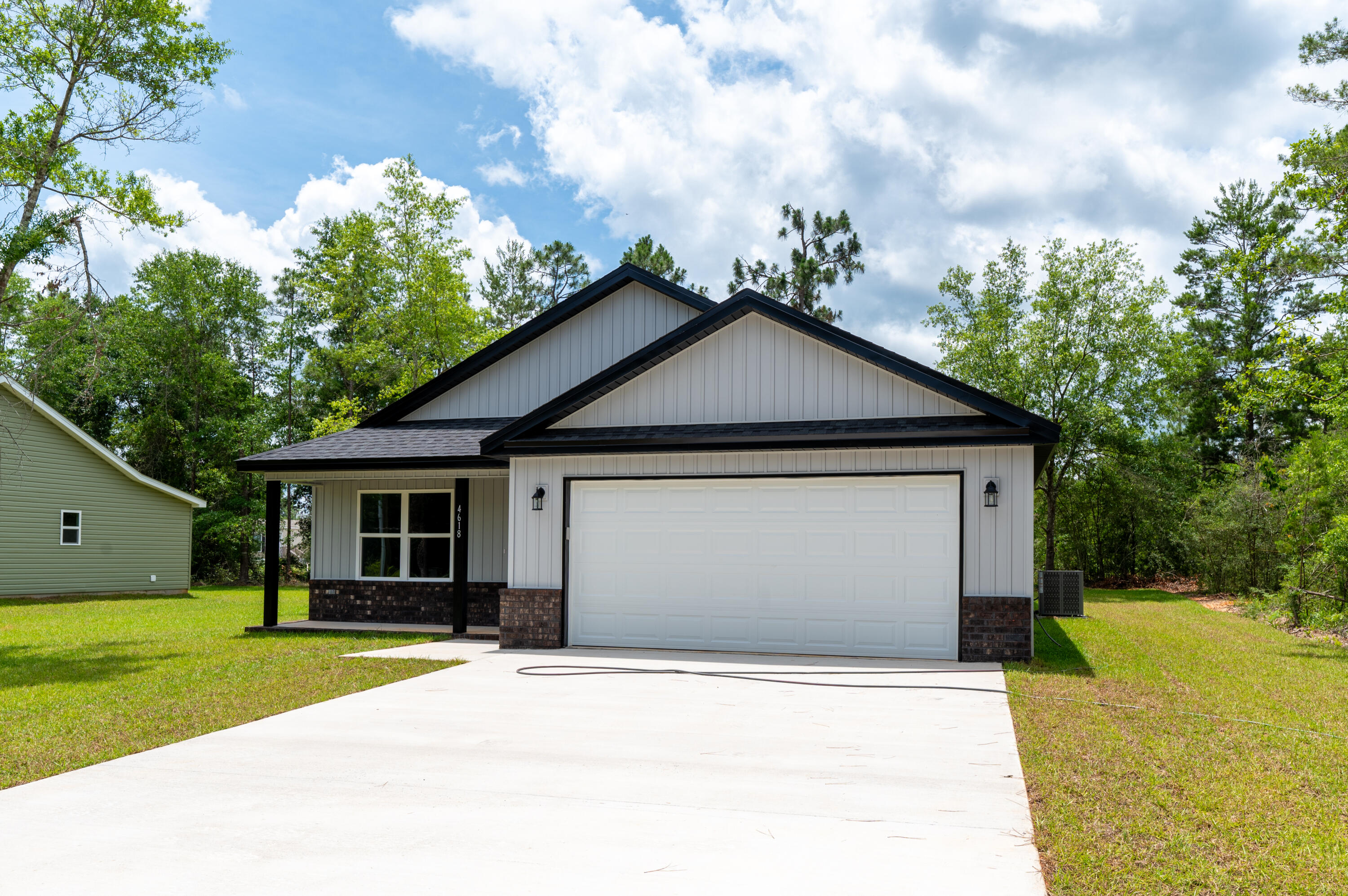 4618 Eagle Way Crestview, FL 32539 - Photo 2 of 12 a front view of a house with a yard and garage