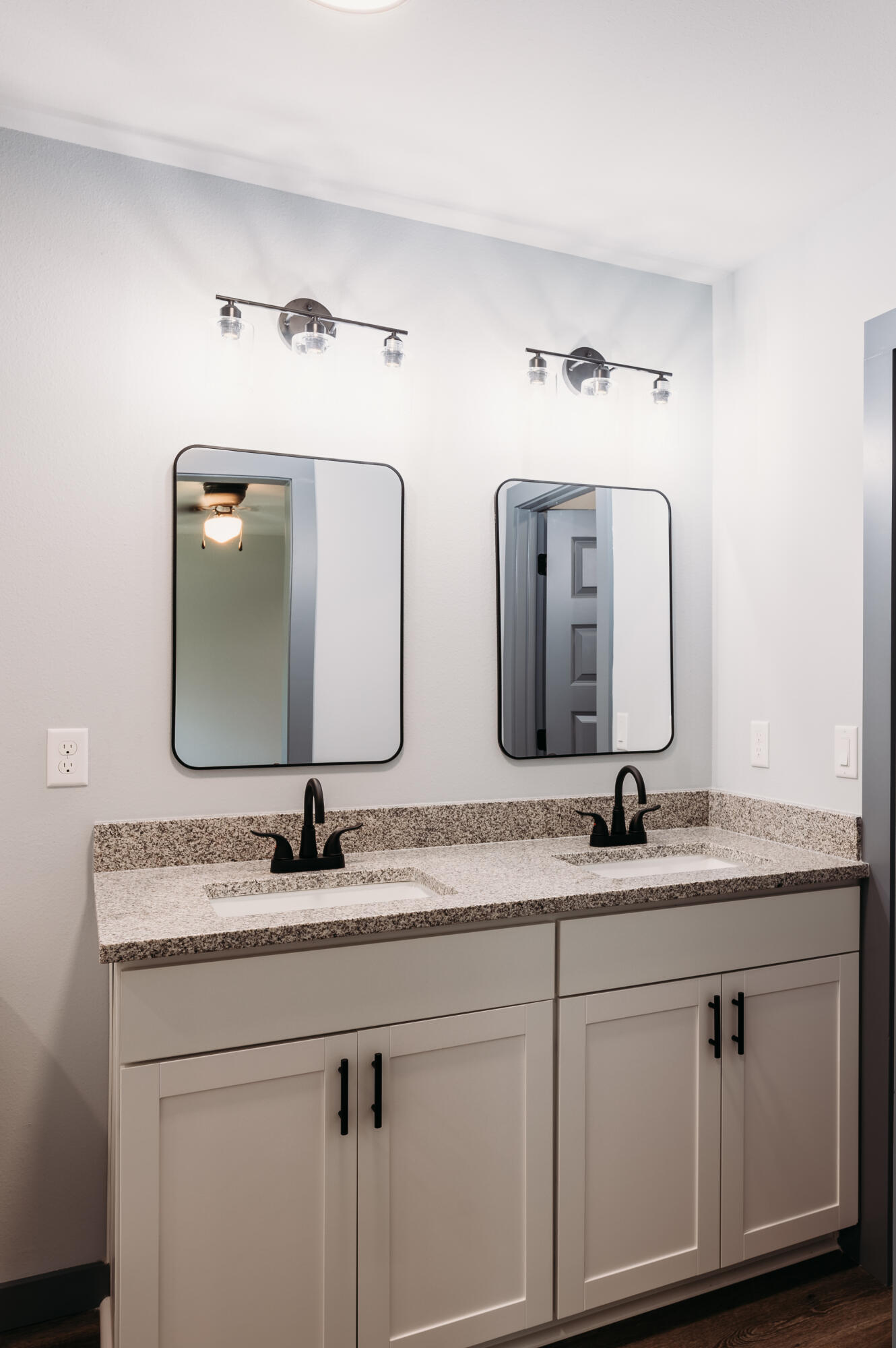 4618 Eagle Way Crestview, FL 32539 - Photo 5 of 12 a bathroom with double vanity sinks and a mirror