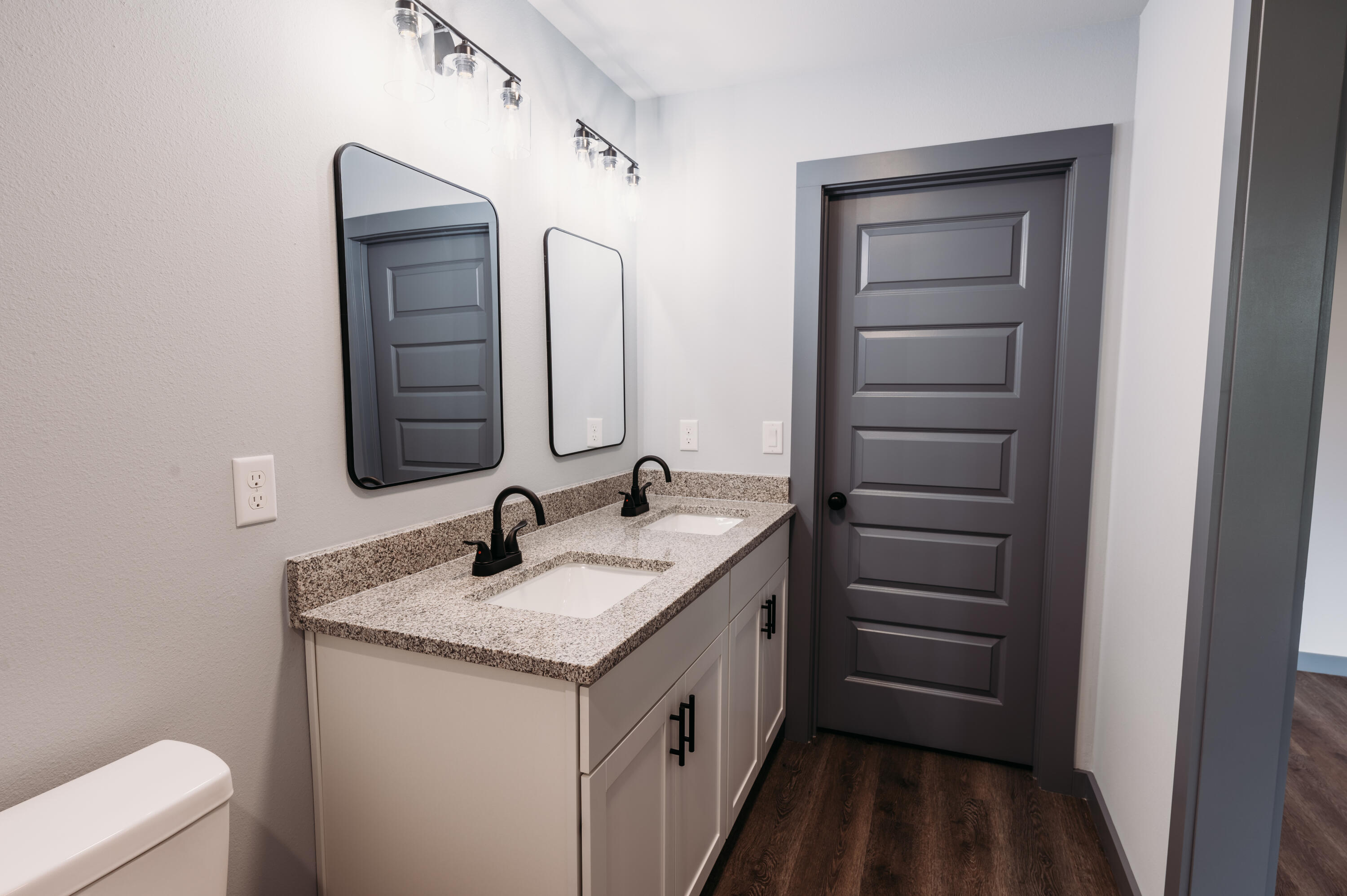 4618 Eagle Way Crestview, FL 32539 - Photo 7 of 12 a bathroom with a double vanity sink and mirror